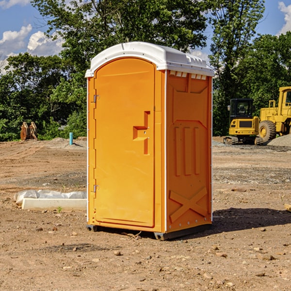 what is the cost difference between standard and deluxe portable restroom rentals in Highland